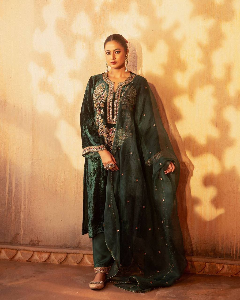 Green party wear outfit made from have pure  Viscous Velvet  with multi color embroidery work:-3024
